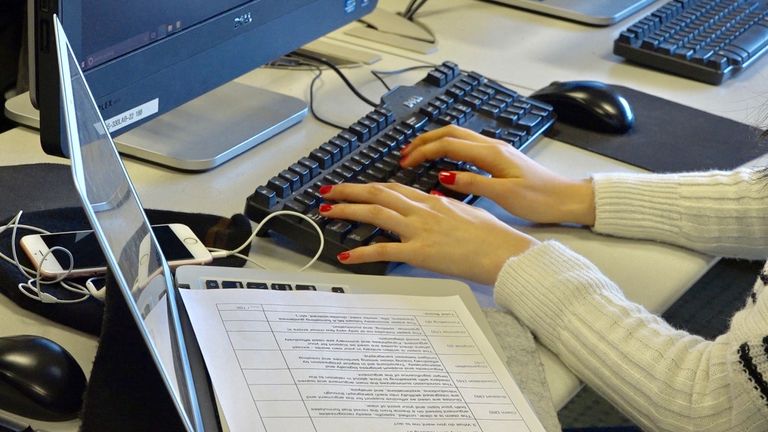 Person typing on a computer