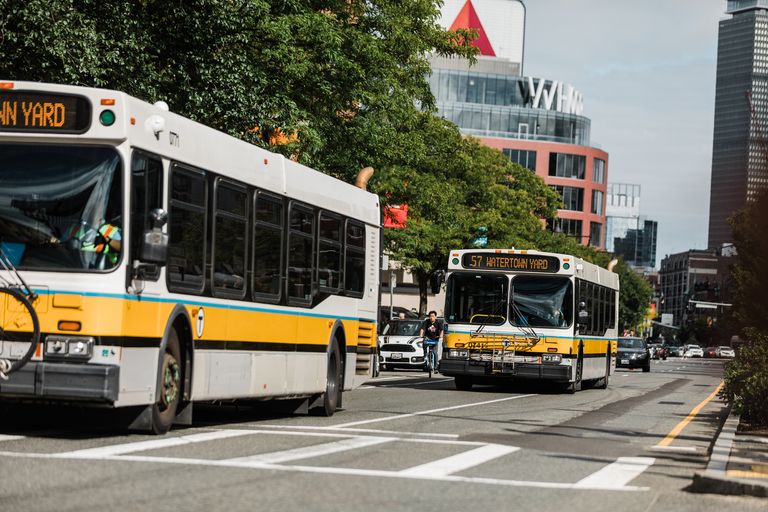 MBTA buses driving on street