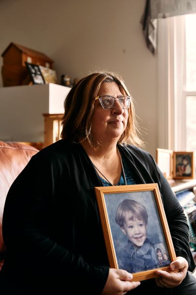 Tanya Lord holding photo of son