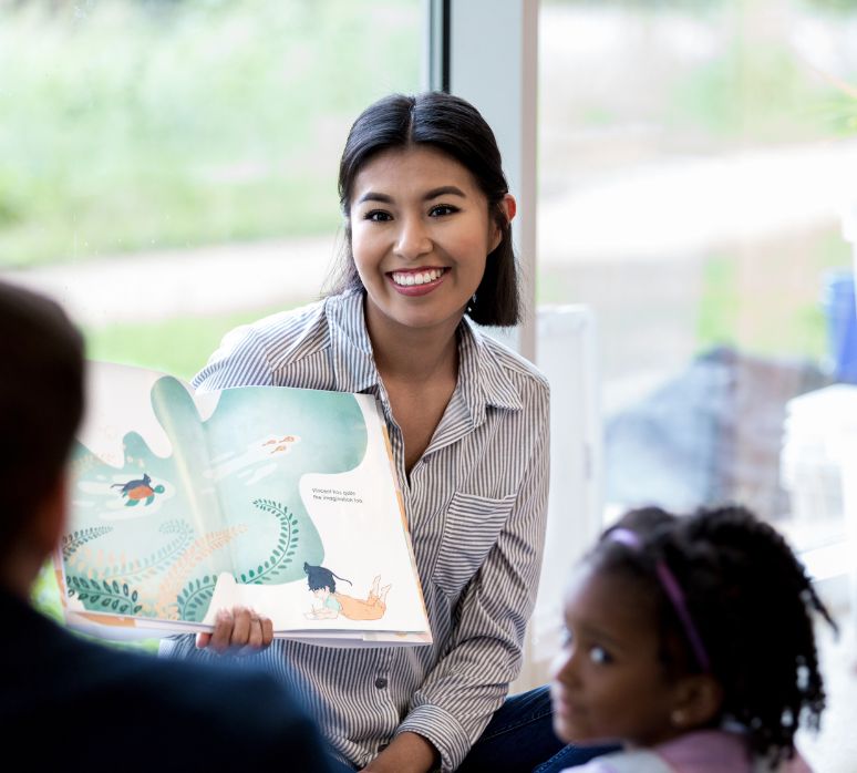Teacher reads book to students