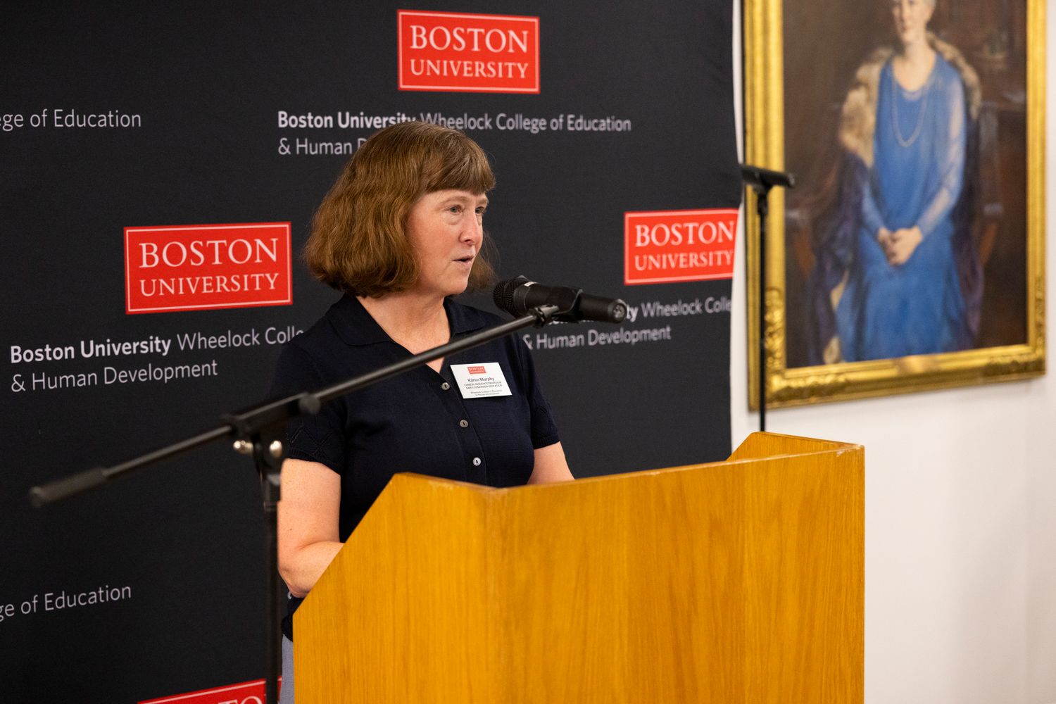 Karen Murphy speaking at a podium