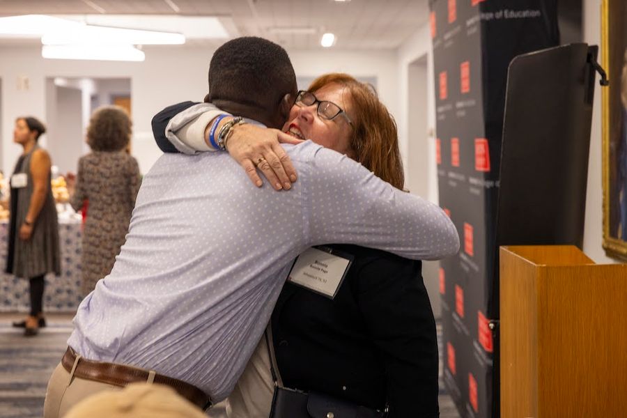 Two Alums hugging at the Lucy Wheelock Tea