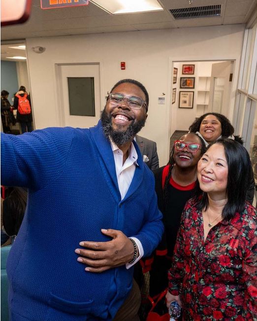 Shows four people, including Tony Jack and Maria Erb, taking a selfie