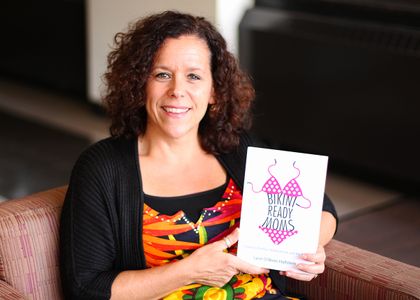 Dr. Lynn O'Brien Hallstein displays her new book, Bikini Ready Moms