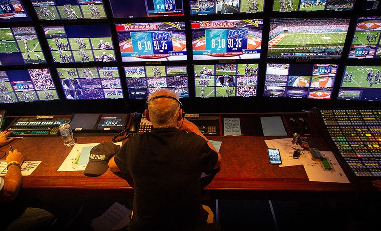 Bob Fishman sits in the control room during an NFL game.