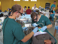 (l-r) Ben Irzyk and Greg Hein, both DMD 14, treat a patient in Guatemala