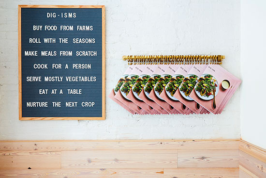 Dig Inn entryway with menus and chalkboard on wall