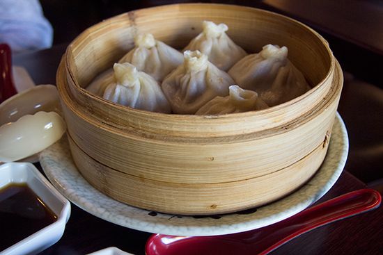 Soup dumplings in a bamboo container