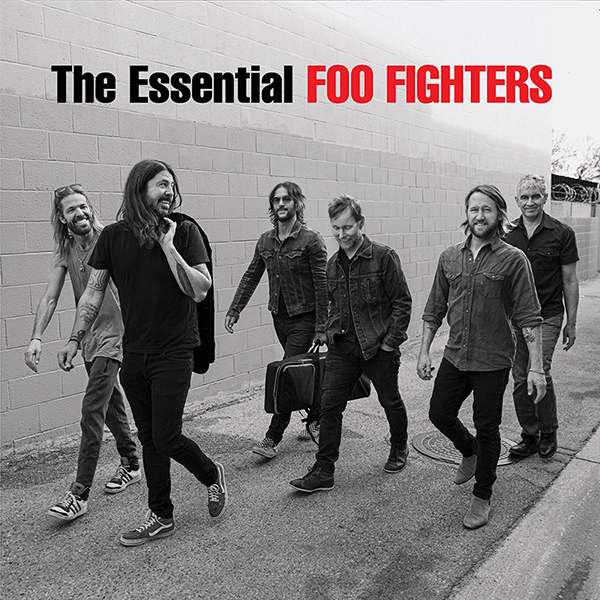 Album Cover shows black and white photo of the Foo Fighters walking down an empty road on a foggy day. Words on top in black read "The Essential" and in red "Foo Fighters"