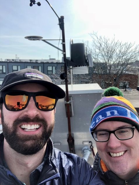 Sean Mueller and Co-PI Dr. Kevin Lane deploying the experimental ultrafine particle monitor in Chelsea, MA. This site is in a mixed-use neighborhood adjacent to major roadways, a commuter rail, an active shipping channel, and downwind of Logan Airport.
