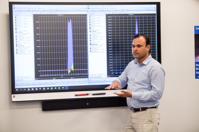 Prof Deepak Kumar explains the results of a human motion test done with the help of a student from Match Charter School April 6, 2017. The freshman physics class was visiting to learn more about biomechanics for National Biomechanics Day April 6, 2017. Photo by Cydney Scott for Boston University Photography