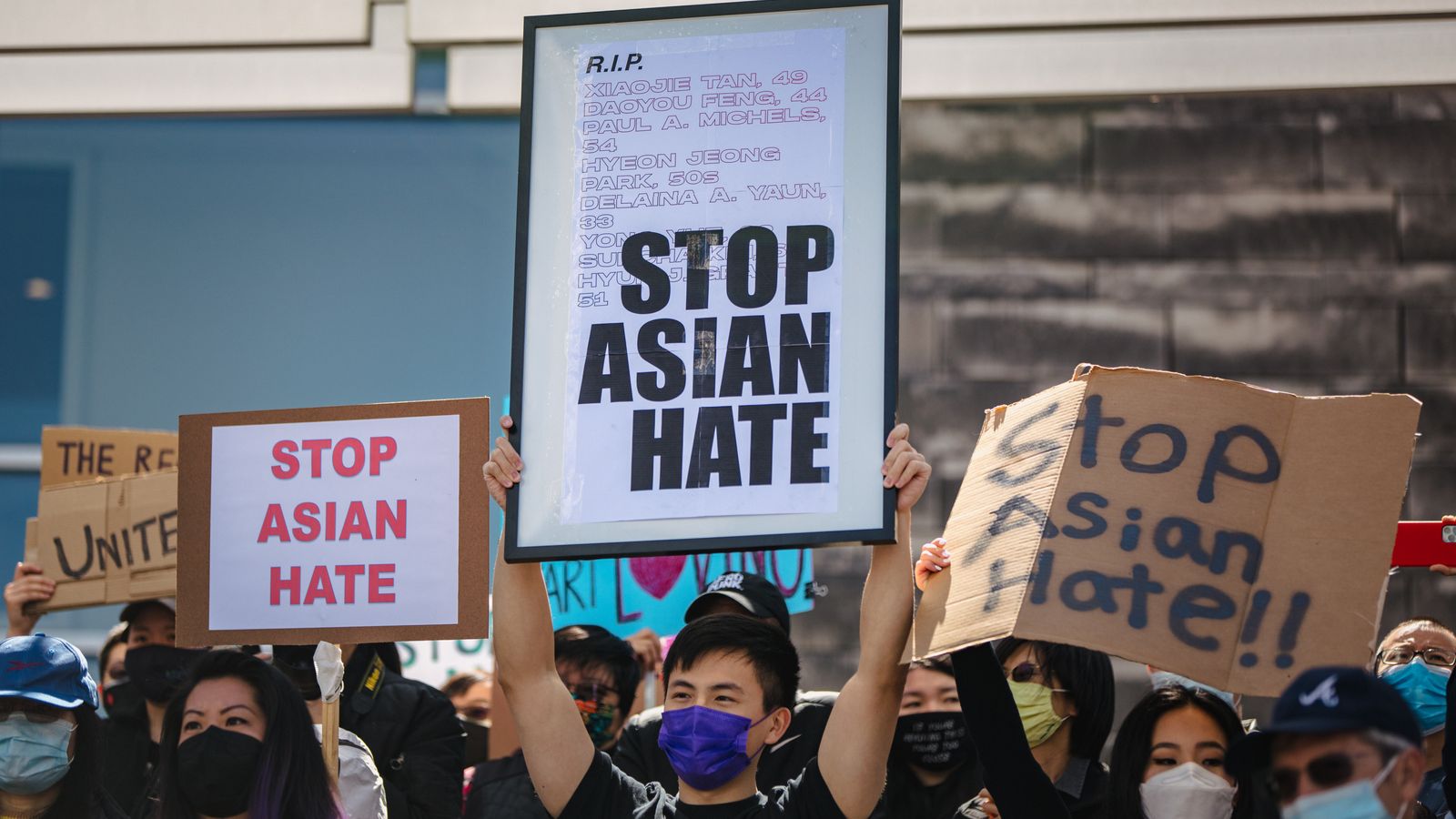 sings saying stop asian hate