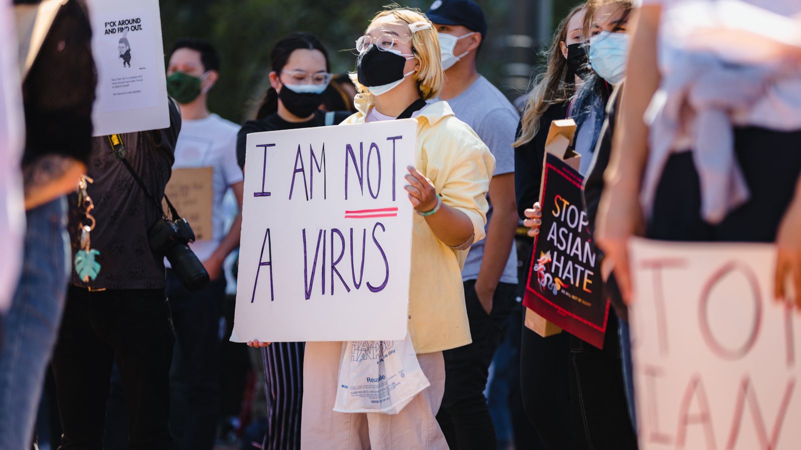protester-with-sign-saying-i-am-not-a-virus