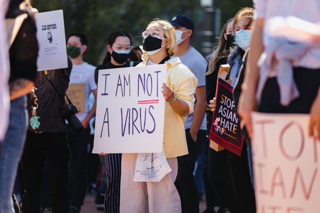 protester-with-sign-saying-i-am-not-a-virus