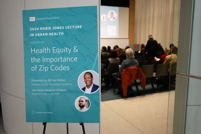 Photo of a poster for the 2024 Hubie Jones Lecture in Urban Health entitled "Health Equity & the Importance of Zip Codes", text reading BU School of Social Work , 2024 Hubie Jones Lecture in Urban Health, Health Equity & the Importance of Zip Codes, presented by M. Lee Pelton, president and CEO of The Boston Foundation and Darien Alexander Williams BUSSW Assistant Professor